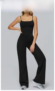 Close-up of premium black sports set featuring thin strap tank top and wide-leg yoga pants