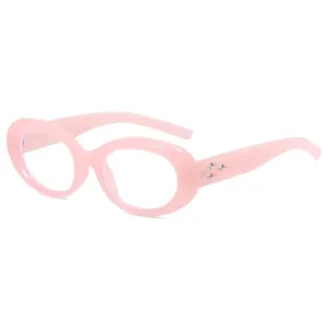 Pink oval frame sunglasses with silver star rivets on the side for a vintage trendy look