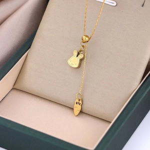 Golden Chinese zodiac rabbit and carrot pendant necklace in a premium gift box