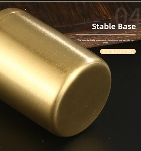 Macro detail of brushed golden stainless steel flat bottom for stable metal storage jar