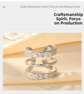 Macro detail of retro three-layer textured titanium steel open ring with hammered finish