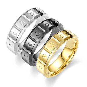 Minimalist titanium steel ring set in silver, black and gold with geometric patterns