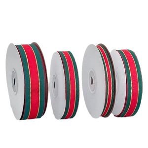 Red and green striped Christmas ribbon rolls with metallic gold edges for gift wrapping