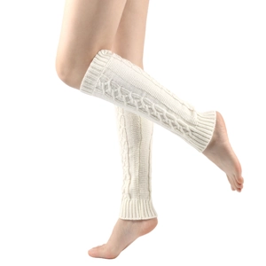 White chunky knit cable leg warmers for women worn on legs over a white background