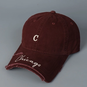 Close-up of distressed wine red baseball cap with white C embroidery and Chicago detail