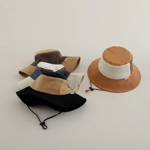 Detail of colorful kids bucket hats with wide brims and adjustable chin cords