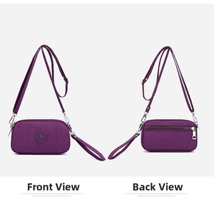 Detail showing front and back of purple nylon crossbody bag with pockets and strap