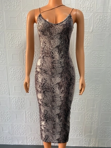 Close-up of sleeveless V-neck midi dress featuring a grey and beige snakeskin pattern print