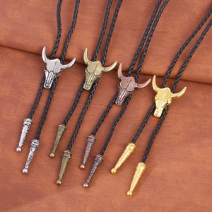 Western cowboy bull skull bolo ties in silver bronze copper and gold finishes