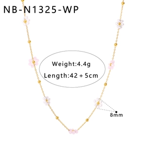 Detail view of gold chain necklace with pink and white floral beads and 4.4g weight marker