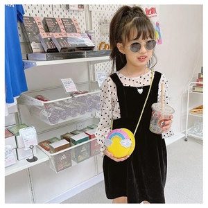Cute yellow kids rainbow crossbody bag with sequins and golden chain strap on model