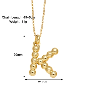 Detailed view of golden letter K pendant necklace with bead design and chain measurements