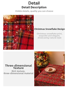 Detail of red plaid Christmas tablecloth with snowflake print and woven linen texture