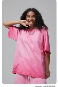 Detail of pink vintage wash t-shirt featuring dropped shoulders and premium cotton texture