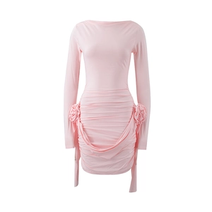 Detail of pink long sleeve ruched dress with decorative 3D floral accents on waist