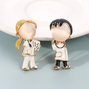 Detail view of male and female medical nurse enamel pins with stethoscope and clipboard