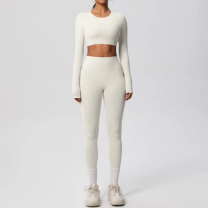 Front full-body view of cream white seamless long sleeve yoga top and leggings set