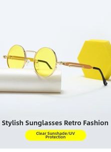 Detail of round steampunk sunglasses with yellow lenses and metal spring temples