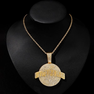 Iced out round pendant necklace with gold twist chain on a premium black mannequin bust