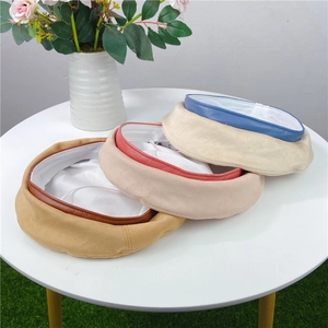 Suede beret with contrasting leather piping and satin lining in three color options