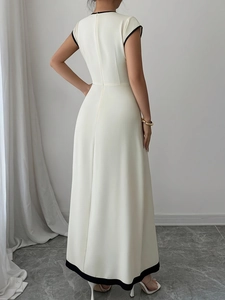 Minimalist cream sleeveless maxi dress with black contrast piping shown from the back