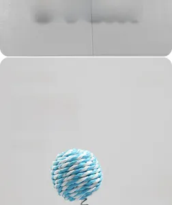 Macro detail of the 61cm sisal cat scratcher with blue and white toy hanging ball