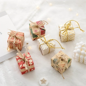 Set of six mini Christmas gift box ornaments with gold patterns for festive tree decoration