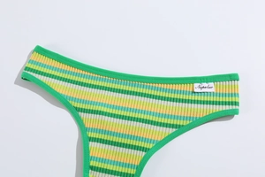 Detailed macro view of green and yellow striped ribbed cotton thong with brand waist label