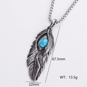 Detail of silver feather pendant with turquoise inlay showing 67.5mm x 22mm dimensions