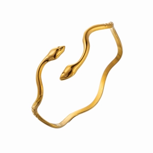 Minimalist gold snake wave bracelet with double head design on white background