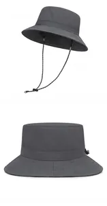 Detail view of dark grey bucket hat featuring quick-dry fabric and adjustable chin strap