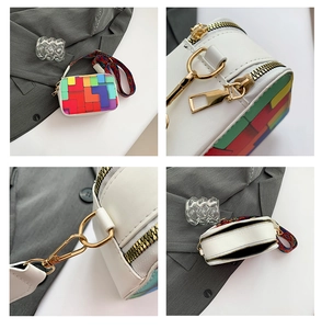 Detail view of colorful geometric crossbody bag featuring gold hardware and woven strap