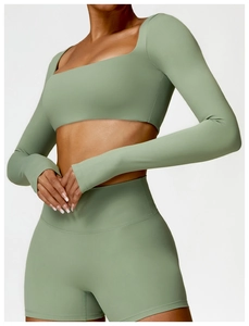 Sage green long sleeve yoga crop top and high waist fitness shorts athletic set