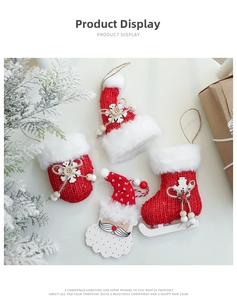 Detail of festive Christmas ornaments set featuring knit gloves, hat and plush skates