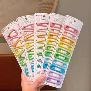 Macro shot of 10pcs colorful candy-colored hairpins in heart and star shapes