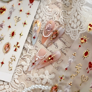 Baroque nail stickers featuring gold 3D angels and red gems on a lace and vintage background