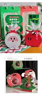 Detail of Christmas gift boxes with Santa and apple shapes and festive clear baubles