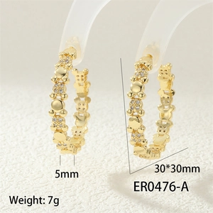 Detail view of gold bear earrings with cubic zirconia, size 30x30mm and weight 7g