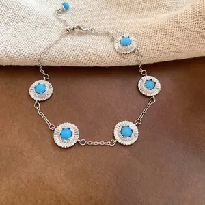 Bracelet argenté vintage avec pierres bleues géométriques et pendentifs de tournesol