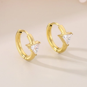 Detailed close-up of 18K gold plated hoop earring with triangular crystal inlay