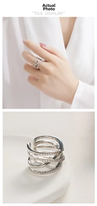 Detail of silver multi-layer crisscross ring with zircon pavé and adjustable open band