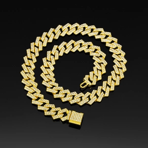 Detail of 15mm gold Cuban link chain with square clasp and embedded zircons