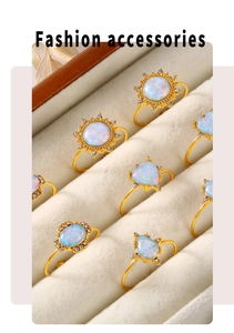 Macro view of gold plated stainless steel rings with opal and sparkling zircon detail
