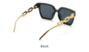 Detail of premium black oversized sunglasses featuring unique gold metal chain temples