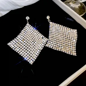 Elegant diamond-encrusted silver rhombus drop earrings with a sparkling mesh design