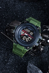 Detail of green sport watch with digital display on dark textured background with metal gear