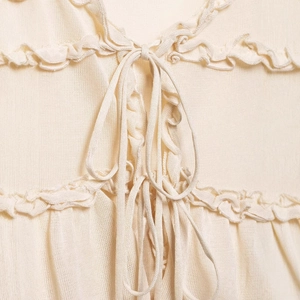 Women's ruffle knit camisole top in cream white with layered details and drawstring