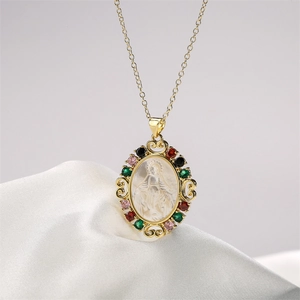 Detailed shot of Virgin Mary pendant with multicolored gemstones on white velvet background
