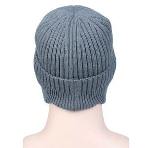 Detail of grey ribbed knit beanie on mannequin showing texture and thermal construction