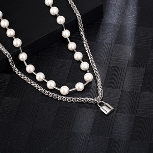 Double-layered dragon bone chain with white pearls and silver padlock pendant for unisex